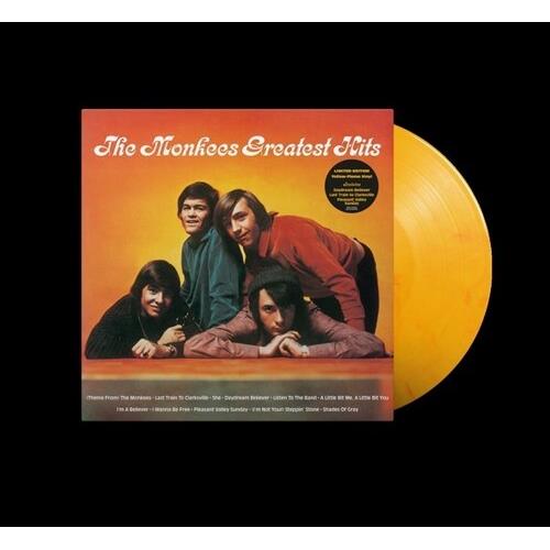 Yellow vinyl LP record partially removed from its orange and red album sleeve featuring a group port