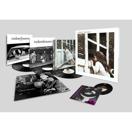 Deluxe vinyl box set with three LPs and a 7-inch single in black and white album art sleeves