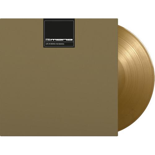 Gold colored vinyl record partially removed from a plain gold sleeve with a black label