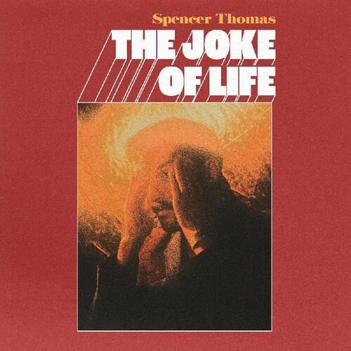 Red vinyl LP cover featuring a man with his hands on his head against an orange background