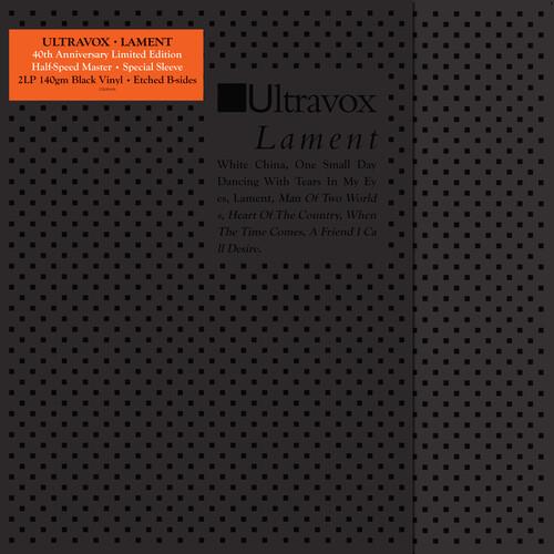Black vinyl LP gatefold with perforated dot pattern and orange hype sticker
