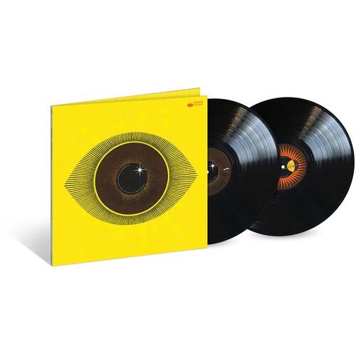 Yellow gatefold vinyl sleeve with a large stylized eye graphic and two black records