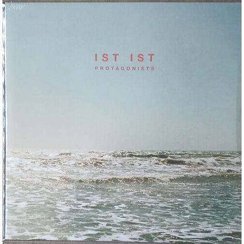 Sea foam green vinyl LP sleeve featuring a photograph of ocean waves under a pale sky