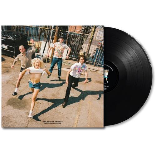 Vinyl LP with a cover photo of four people posing outdoors on a paved surface