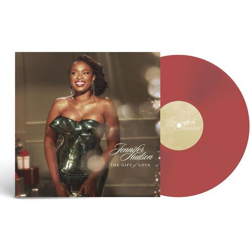 Red vinyl record partially removed from album sleeve featuring a woman in a green strapless dress