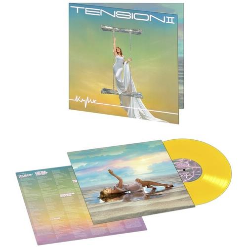 Yellow vinyl record with gatefold sleeve featuring a woman in a white dress on a swing