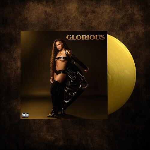 Opaque gold vinyl record with album cover featuring a woman in black leather outfit