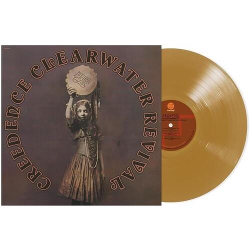 Gold vinyl LP record with album cover featuring a woman holding a Mardi Gras mask