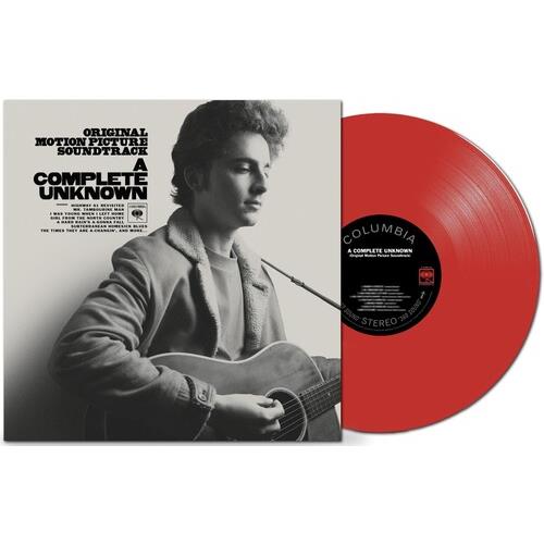 Red translucent vinyl record partially removed from a black and white album cover featuring a man pl
