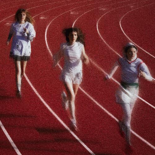 Three women running on a red track with white lane lines