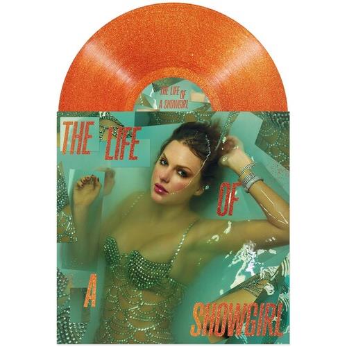 Orange glitter vinyl record partially visible behind an album cover featuring a woman in a green seq