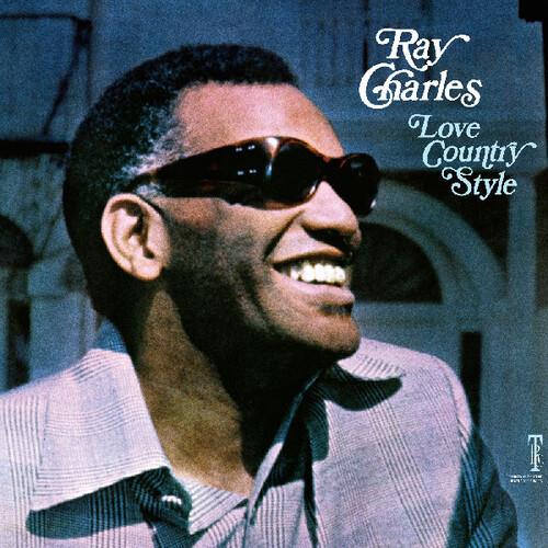 Portrait of Ray Charles wearing dark sunglasses and a light blue striped shirt