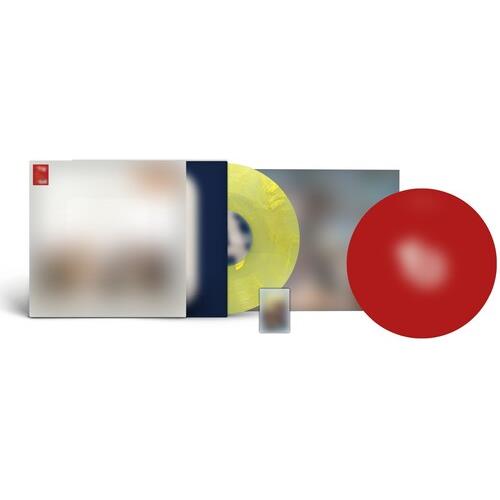 Yellow translucent vinyl record with a red circular insert and album sleeve