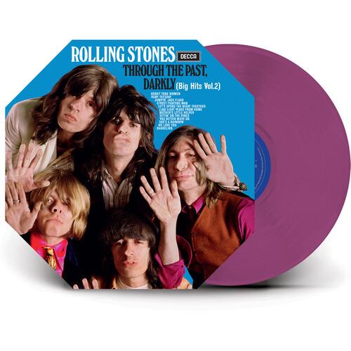 Magenta vinyl record leaning against a blue album cover featuring five band members