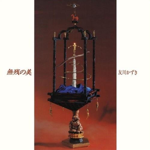 Ornate black wooden shrine with a central white pillar and blue fabric base