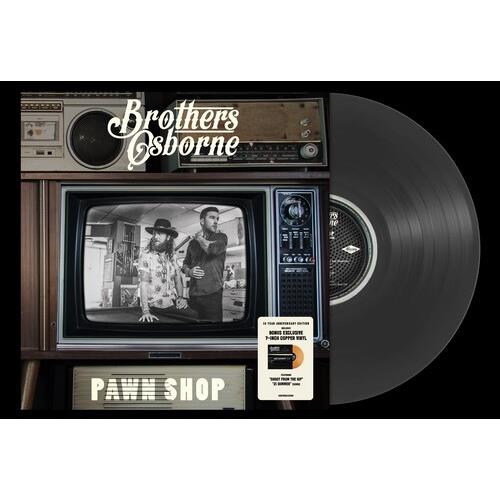 Vintage television console displaying a black and white photo of two musicians with a black vinyl re
