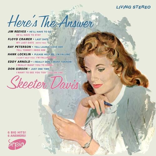 Vintage vinyl LP cover featuring a portrait of a woman with wavy hair holding a pen, with a tracklis