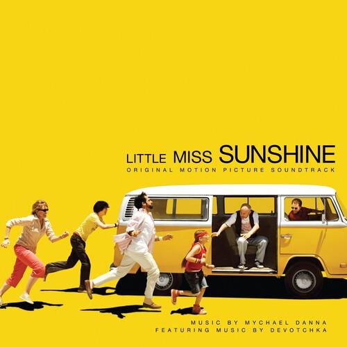 Yellow vinyl LP cover featuring a family pushing a white and yellow Volkswagen van