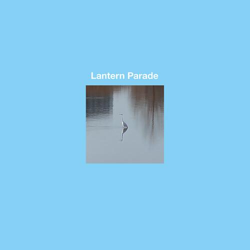 Square vinyl record sleeve with a photograph of a heron standing in calm water