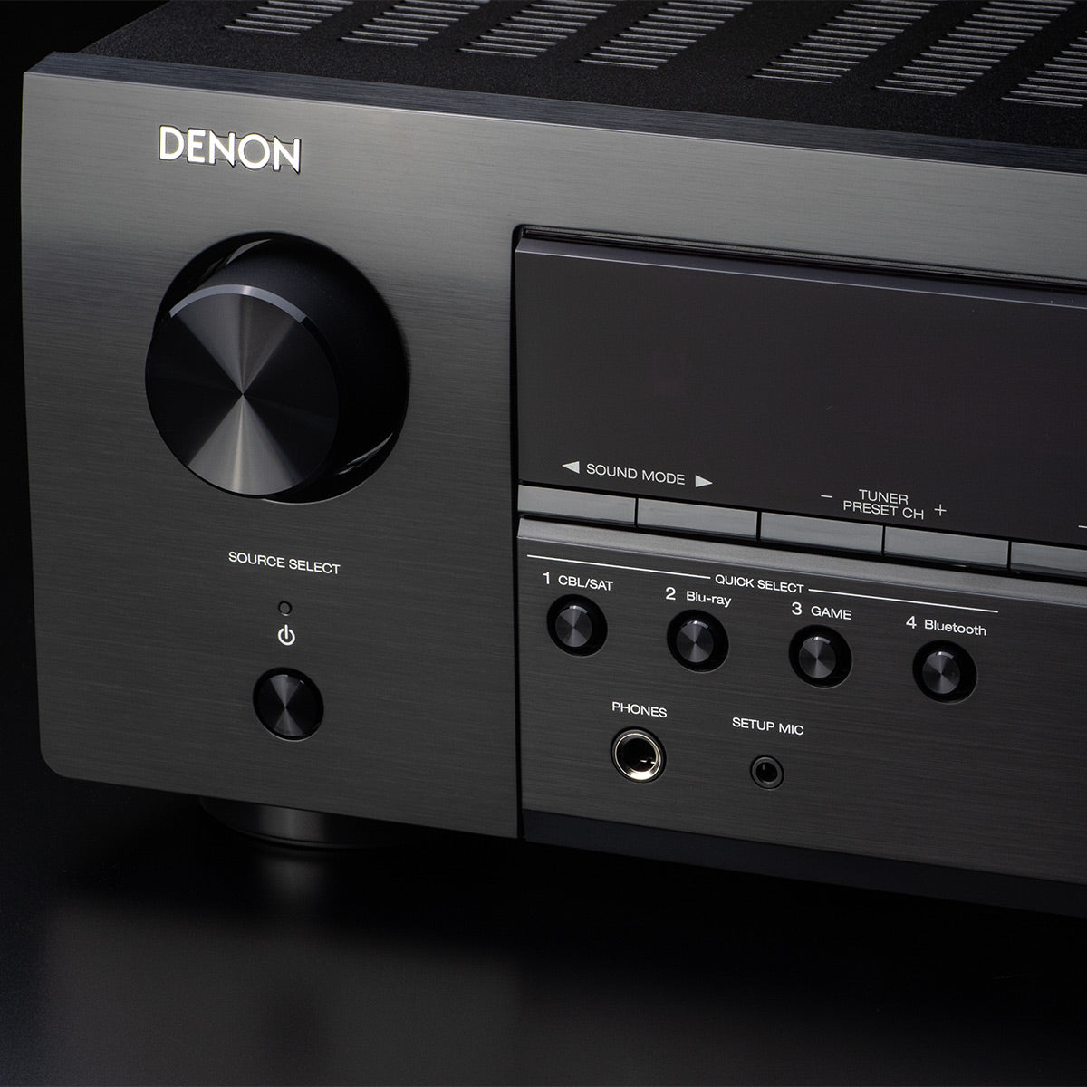 Black 5.2 channel home theater receiver with front display and control knobs, front view