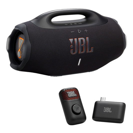 Black portable speaker with top handle and orange accents, accompanied by a wireless microphone and
