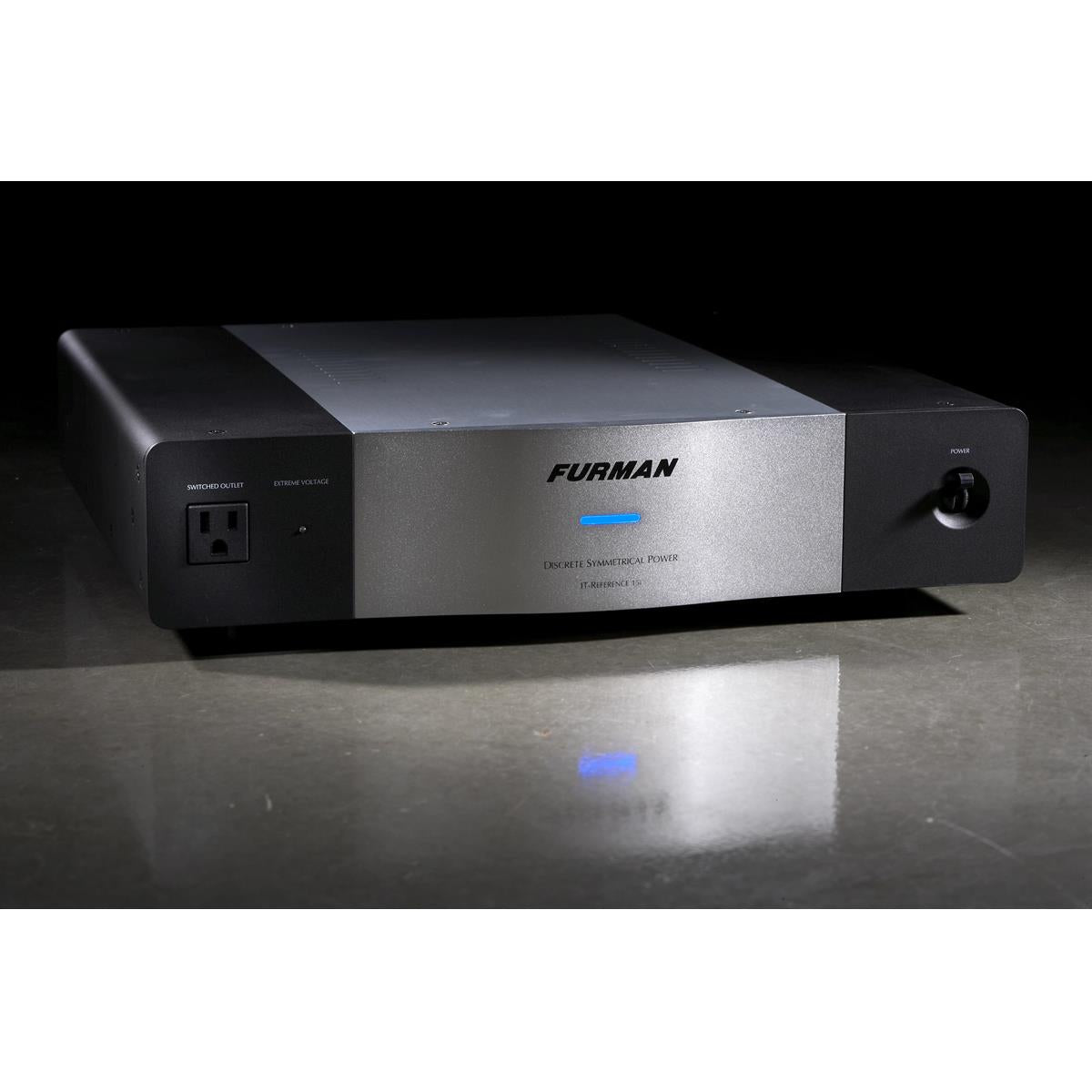 Black and silver power conditioner with a front switched outlet and blue LED indicator
