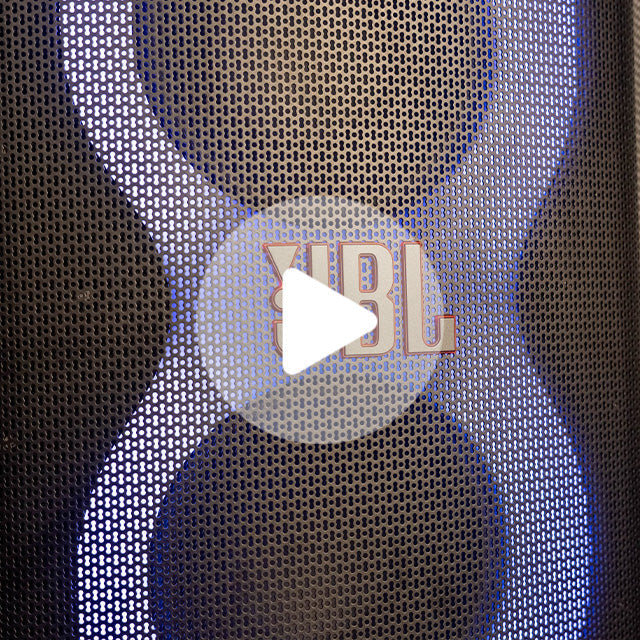 Black speaker grille with a central JBL logo badge and blue LED lighting