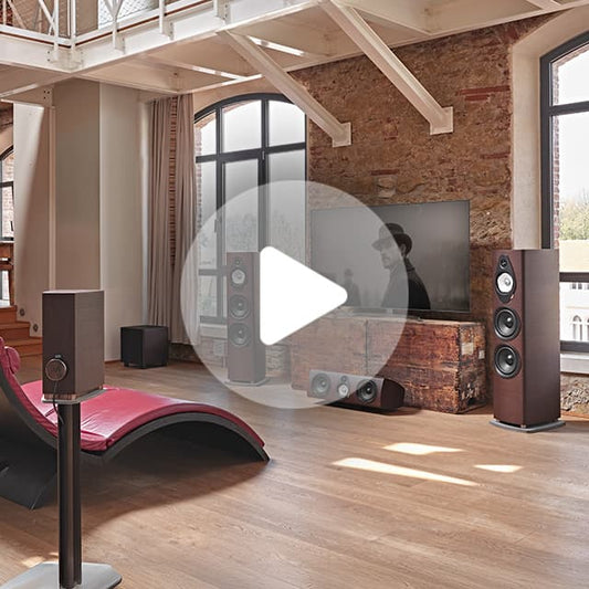 Brown floor-standing speaker with three visible drivers and a sleek wooden cabinet