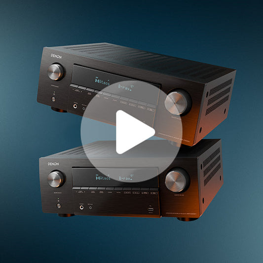 Black Denon AV receiver with brushed metal finish, large volume knob, and front display panel