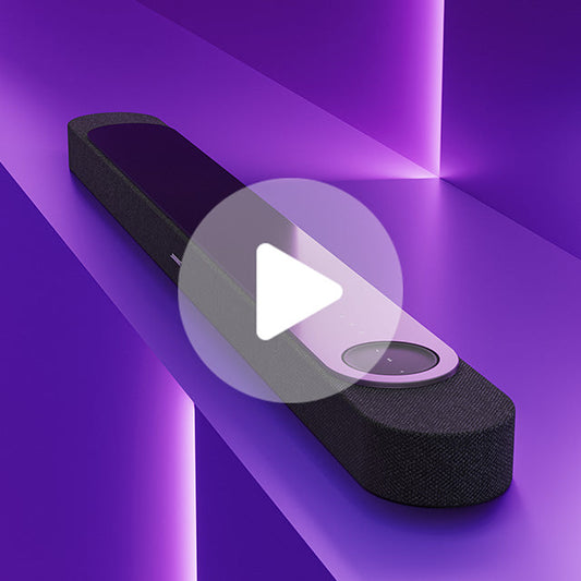Black fabric soundbar with a circular control dial and a play button overlay