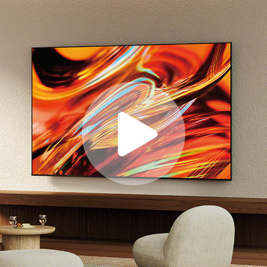 Wall-mounted flat-screen TV displaying vibrant orange and red abstract swirls with a play button ove
