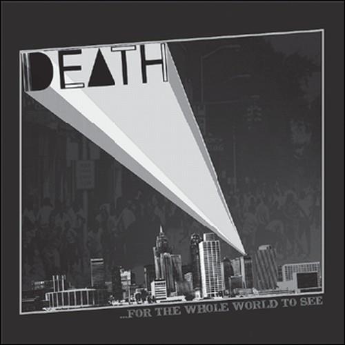Black and white album cover with a spotlight beam over a city skyline
