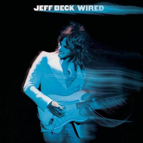 Blue-tinted album cover featuring a guitarist playing an electric guitar with motion blur