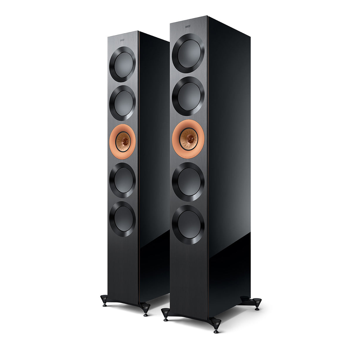 Pair of high-gloss black floorstanding speakers with copper-colored drivers and spiked feet