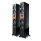 Pair of high-gloss black floorstanding speakers with copper-colored drivers and spiked feet