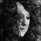 Black and white portrait of a person with voluminous curly hair