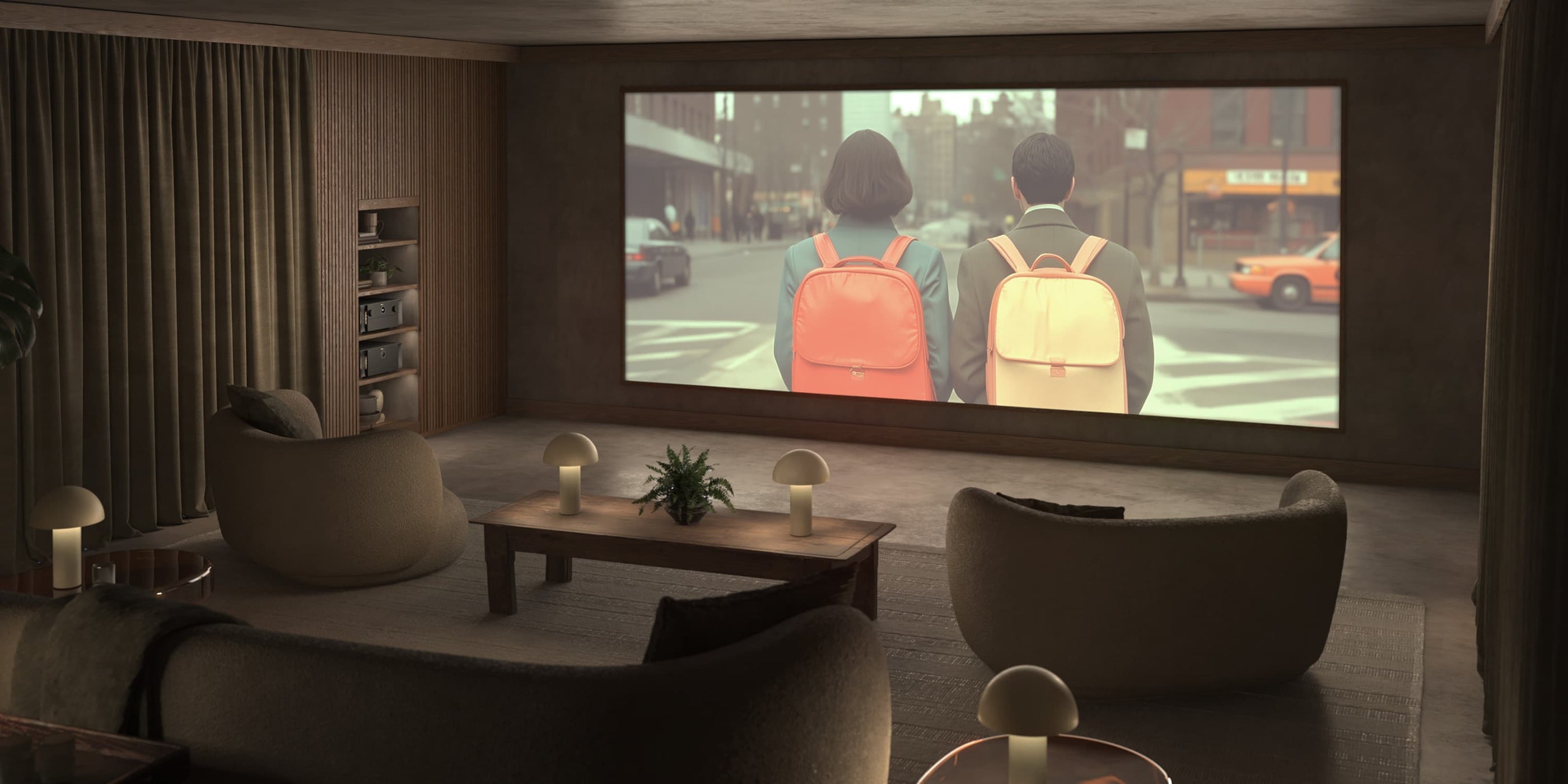 Home theater setup with a large screen, speakers, and a couch in a dimly lit room.