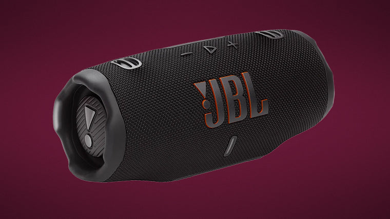 Black cylindrical portable speaker with orange JBL logo and rubberized control buttons