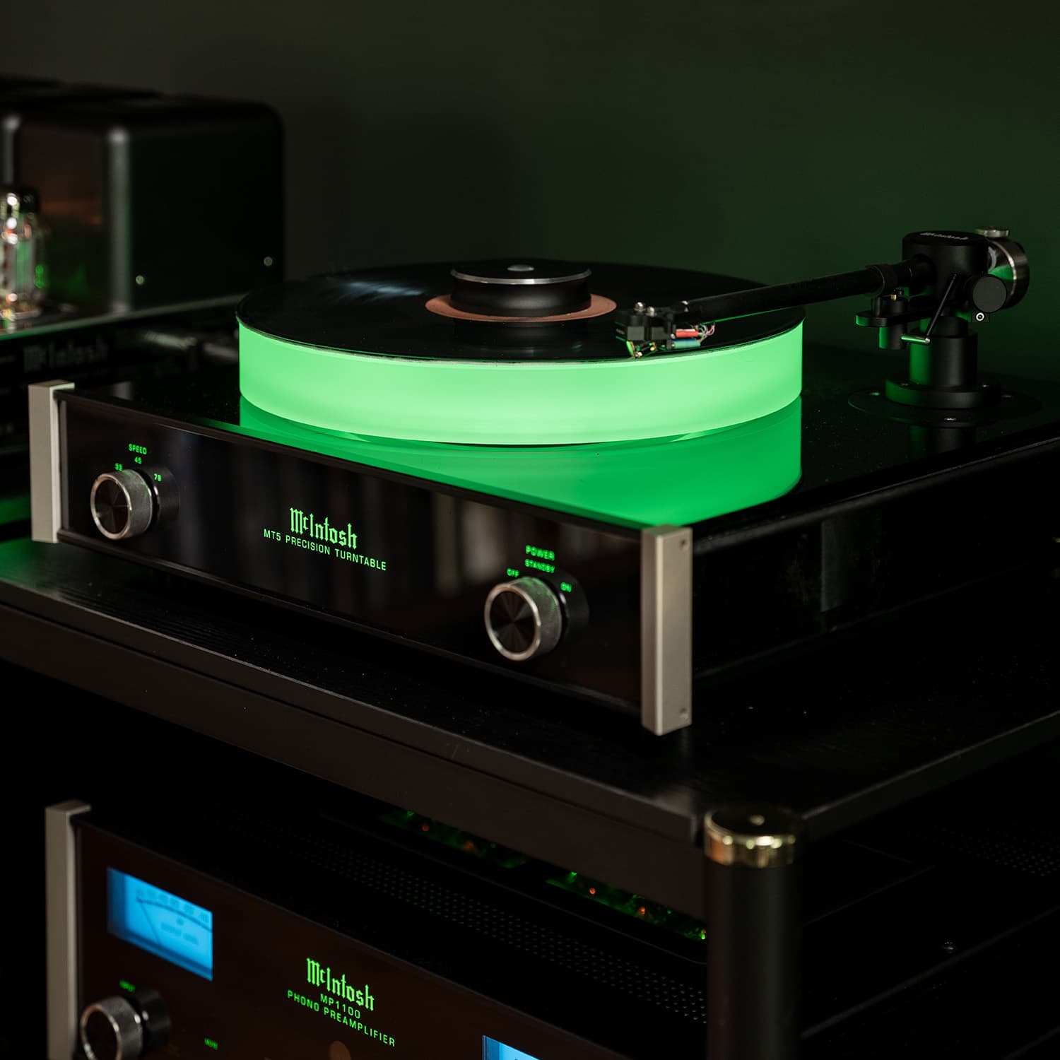 McIntosh MT5 Precision Turntable with green illuminated platter and MP1100 phono preamplifier in a high-end audio system in Washington Crossing, PA