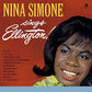 Vinyl LP cover featuring a close-up portrait of Nina Simone smiling against a red background