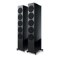 Pair of high-gloss black floorstanding speakers with five circular drivers and spiked feet