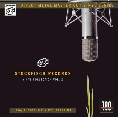 Vinyl record album cover featuring a silver studio microphone on a black background with gold text