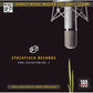 Vinyl record album cover featuring a silver studio microphone on a black background with gold text