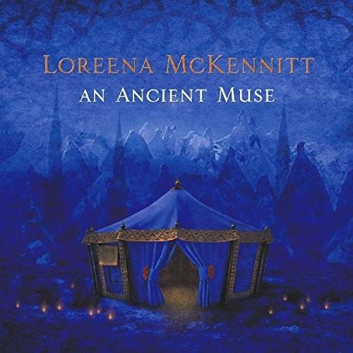 Blue vinyl album cover featuring a glowing tent set against a mountainous landscape