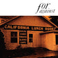 Sepia-toned photograph of a wooden building with a California Lunch Room sign