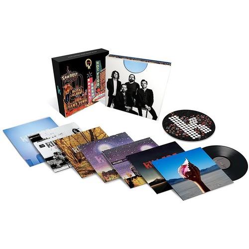 Deluxe vinyl box set with multiple album sleeves and a checkered picture disc