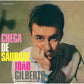 Vinyl record cover featuring a portrait of a man resting his chin on his hand with bold pink and yel