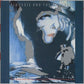 Blue and white stylized portrait of a woman with dark hair and bold makeup on a vinyl record sleeve