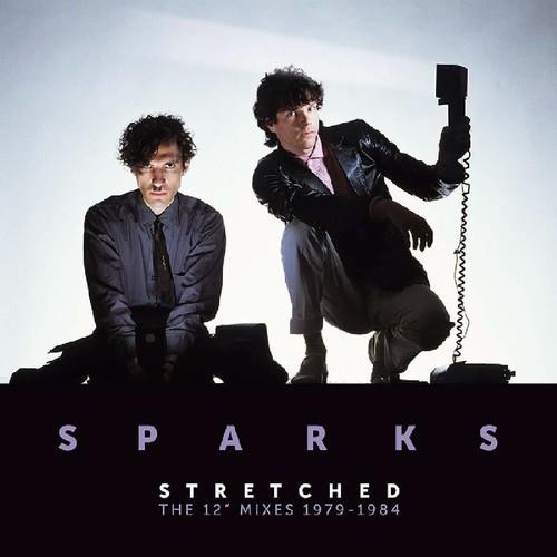 Album cover featuring two men in dark suits against a light background