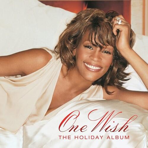Whitney Houston smiling on the cover of a holiday vinyl album